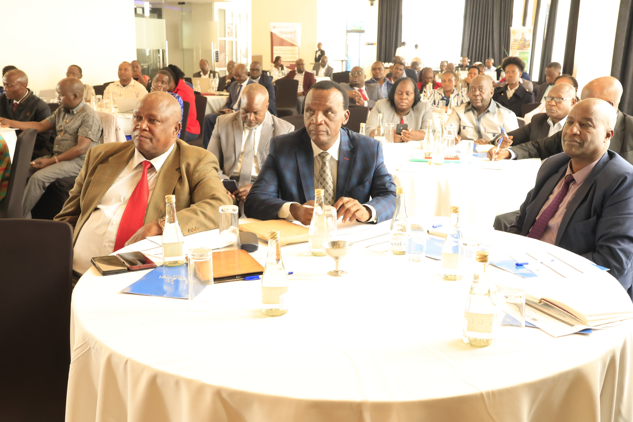 Director, Enterprise Development, Mr. Nobby Macharia (right), Director Research, Manufacturing and Industrialization Policy, Mr Roy Nyangena (centre) and Director Industrialization Field Services, Mr. Joseph Mbeva (left), actively take part in the validation of the National Cotton, Textile, and Apparel Policy, held at PrideInn Azure on March 18, 2025. Photo by Salome Kahora