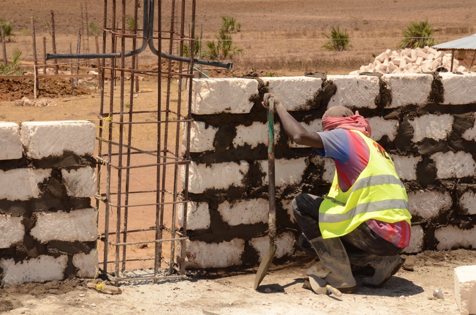 Workers working on a section of the cold storage facility at the Kwale County Aggregation and Industrial Park (CAIP) in Dzombo, Lungalunga sub county in Kwale County. / Jared Nyabuti